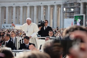 VATICAN - October 30: Pope Francis I on the popemobile blesses the faithful crowd in St. Peter's Square in Vatican on October 30, 2013.